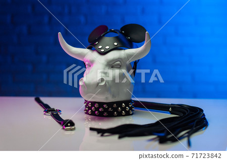 statuette of a white metal bull in a leather mask and accessories for BDSM games statuette of a white metal bull in a leather mask and accessories for BDSM games 71723842