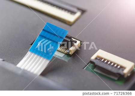 Computer connector and cable on the processor electronic board. Disassembly and cleaning of the computer. Part of laptop 71726366