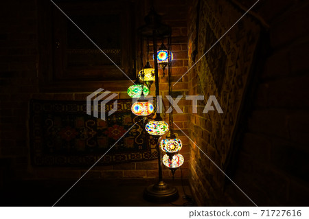 Vintage wall lamp with eastern ornates on it. 71727616