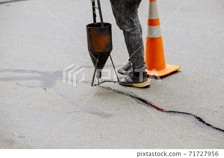 Asphalt seal restoration work filler asphalt crack repair, liquid, joint sealant joint 71727956