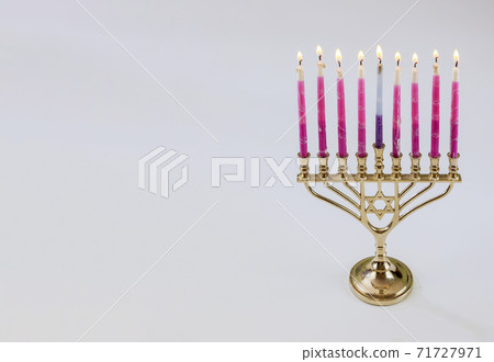 Traditional symbol hebrew Menorah of Hanukkah with burning candles is for Jewish holiday 71727971