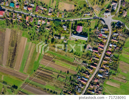 Aerial view of the European beautiful village with fields Aerial view of the European beautiful village with fields 71728091