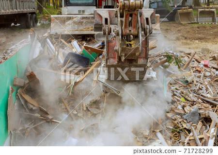 Excavator with crusher house demolition after hurricane Excavator with crusher house demolition after hurricane 71728299