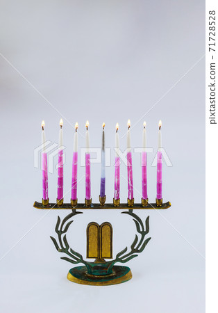Menorah of Hanukkah with burning candles is traditional symbol for Jewish holiday Menorah of Hanukkah with burning candles is traditional symbol for Jewish holiday 71728528