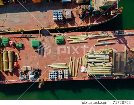 Cargo transportation by construction materials transportet building pipes and metal structures on barges 71728763