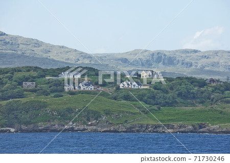 People enjoying living in beautiful landscape full of rock formations along the irish coastline near Killybegs, County Donegal in Ireland People enjoying living in beautiful landscape full of rock formations along the irish coastline near Killybegs, County Donegal in Ireland 71730246