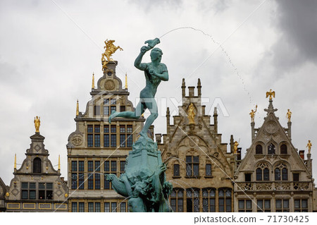 Brabo fountain and traditional flemish architecture at Grote Markt square in Antwerp in Belgium. Brabo fountain and traditional flemish architecture at Grote Markt square in Antwerp in Belgium. 71730425