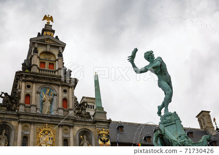 Brabo fountain and traditional flemish architecture at Grote Markt square in Antwerp in Belgium. Brabo fountain and traditional flemish architecture at Grote Markt square in Antwerp in Belgium. 71730426