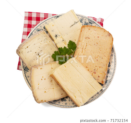 Raclette cheese platter with several flavors Raclette cheese platter with several flavors 71732154