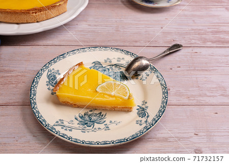 Slice of lemon pie on an old plate Slice of lemon pie on an old plate 71732157