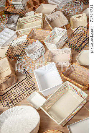 Flat lay of Marie Kondo's storage boxes, containers and baskets with different sizes and shapes Flat lay of Marie Kondo's storage boxes, containers and baskets with different sizes and shapes 71734781