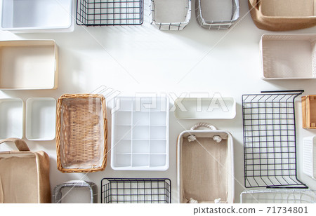 Top view of closet organization boxes and steel wire baskets in different shapes. Top view of closet organization boxes and steel wire baskets in different shapes. 71734801