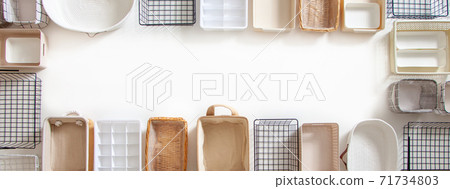 Top view of closet organization boxes and steel wire baskets in different shapes. 71734803