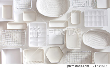 Flat lay of Marie Kondo's white storage boxes, containers and baskets with different sizes and shapes Flat lay of Marie Kondo's white storage boxes, containers and baskets with different sizes and shapes 71734814
