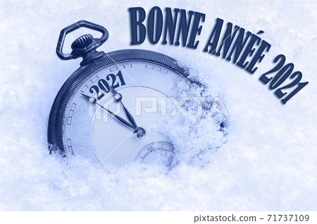 Happy New Year 2021 greeting in French language, bonne annee text, pocket watch in snow, 2021 greeting, 2021 new year, clock 71737109