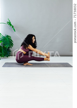 Beautiful brunette woman engaged in yoga sports fitness asana body flexibility 71738032