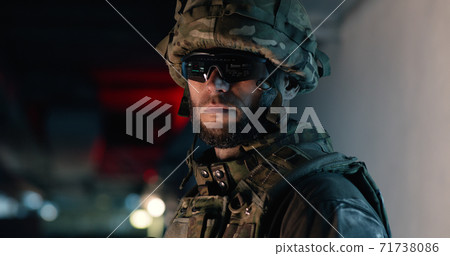 Soldier in hi tech goggles during military mission Soldier in hi tech goggles during military mission 71738086