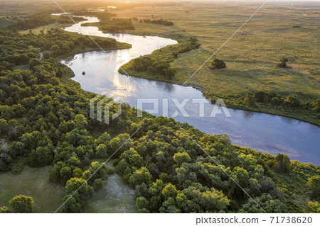 sunrise over Dismal River in  Nebraska Sandhills 71738620