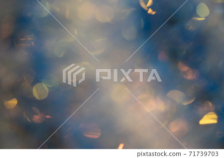 Abstract blurred gold background with beautiful bokeh effect. 71739703