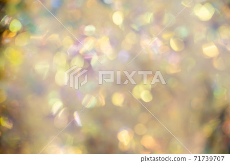 Abstract blurred gold background with beautiful bokeh effect. Abstract blurred gold background with beautiful bokeh effect. 71739707