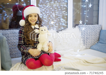 Winter feast. Happy winter holidays. Small girl at home 71740245