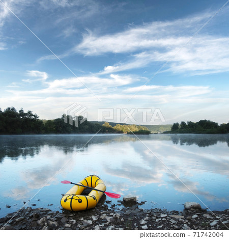 Yellow packraft rubber boat with red padle Yellow packraft rubber boat with red padle 71742004