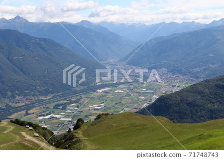 View of the foot from the Monte Tamaro hiking course in Ticino, Switzerland View of the foot from the Monte Tamaro hiking course in Ticino, Switzerland 71748743
