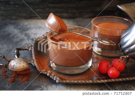 Two portions of chocolate mousse, cocoa powder dressing Two portions of chocolate mousse, cocoa powder dressing 71752807