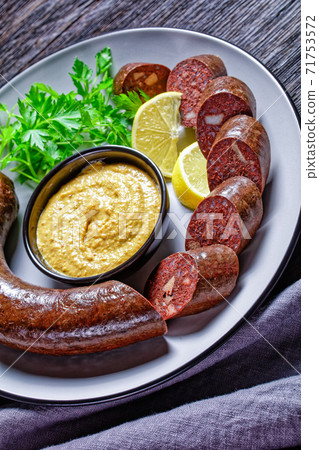 Blutwurst or german blood sausage on a plate Blutwurst or german blood sausage on a plate 71753572