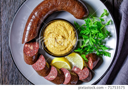 Blutwurst or german blood sausage on a plate Blutwurst or german blood sausage on a plate 71753575