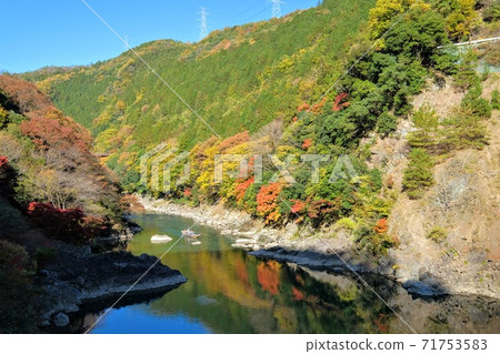 Autumn leaves of Hozukyo seen from Sagano Sightseeing Railway trolley train Autumn leaves of Hozukyo seen from Sagano Sightseeing Railway trolley train 71753583