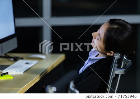 Asian lady call center worker employee sleeping on dest at night Asian lady call center worker employee sleeping on dest at night 71753946