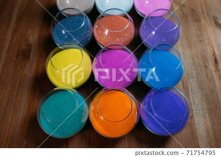 ollection of decorative candles on a rustic antique wooden background 71754795