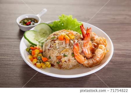 chinese fried rice with barbecue prawn on wooden table 71754822