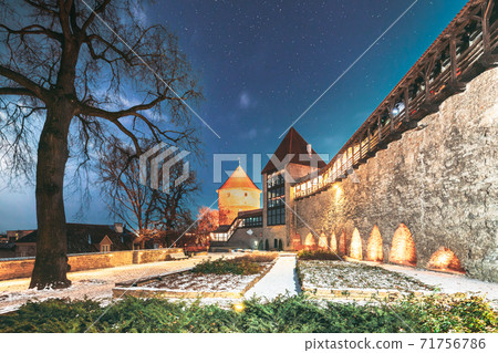 Tallinn, Estonia. Night Starry Sky Above Traditional Old Architecture Skyline In Old Town. Former Prison Tower Neitsitorn In Winter Evening Night. Famous Landmark. Altered Sky With Stars Tallinn, Estonia. Night Starry Sky Above Traditional Old Architecture Skyline In Old Town. Former Prison Tower Neitsitorn In Winter Evening Night. Famous Landmark. Altered Sky With Stars 71756786