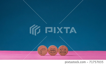 Three wooden cut circles with contact and communication icons 71757035