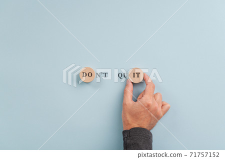Male hand making a Don't quit sign 71757152