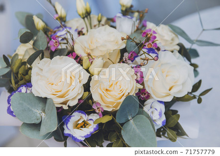 flowers , bouquet with white roses and eucalyptus branches on a light flowers , bouquet with white roses and eucalyptus branches on a light 71757779