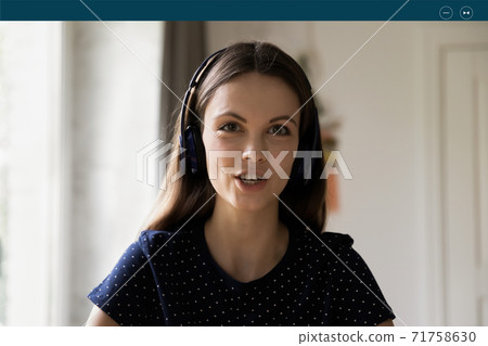 Confident young caucasian woman holding web camera call. 71758630