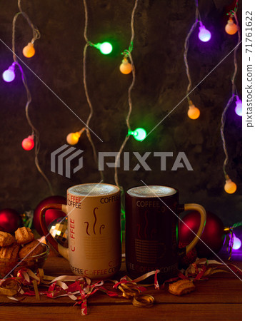 Christmas coffee cups with flickering bokeh lights decoration. Winter holidays music background, cozy home good morning. 71761622