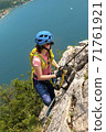 Beautiful Woman on Via Ferrata Trail 71761921