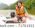 Man Driving the Motorboat 71761922