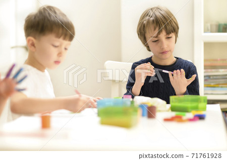 Kid Painting at Kindergarten Kid Painting at Kindergarten 71761928