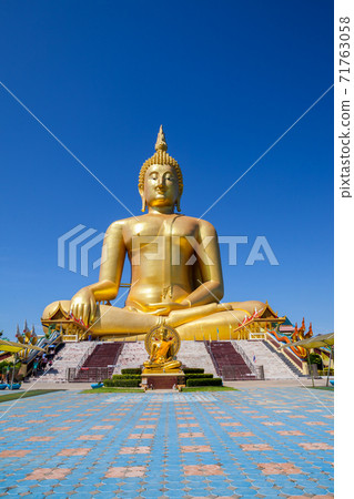 Golden Buddha with clear sky 71763058