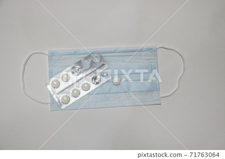 New Coronavirus 2019. Surgical medical protective mask cover the mouth and nose. Procedure mask from bacteria. Protection concept, copy space-nCoV. 71763064