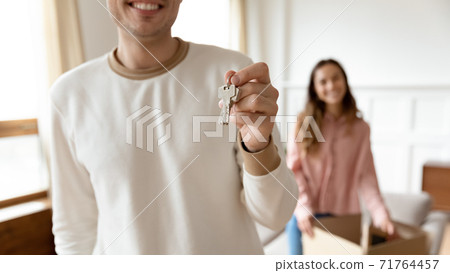 Excited husband happy family show keys to own home Excited husband happy family show keys to own home 71764457