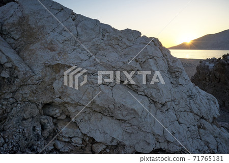 Close up of big stone on the beach. 71765181