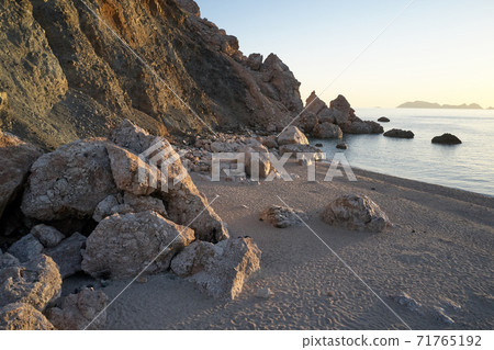 Rocks on beach with sea view. 71765192