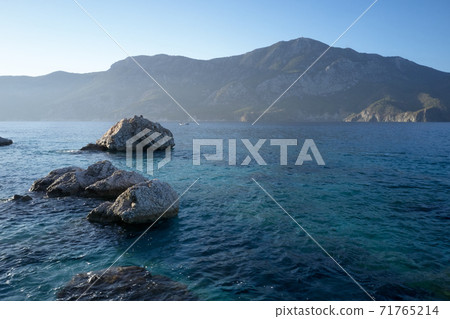 Mediterranean seascape with mountains and sky on background. Mediterranean seascape with mountains and sky on background. 71765214