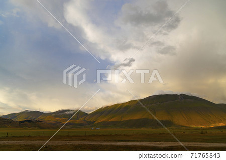 Dramatic mountain landscape near Castelluccio village in National Park Monte Sibillini, Umbria region, Italy Dramatic mountain landscape near Castelluccio village in National Park Monte Sibillini, Umbria region, Italy 71765843